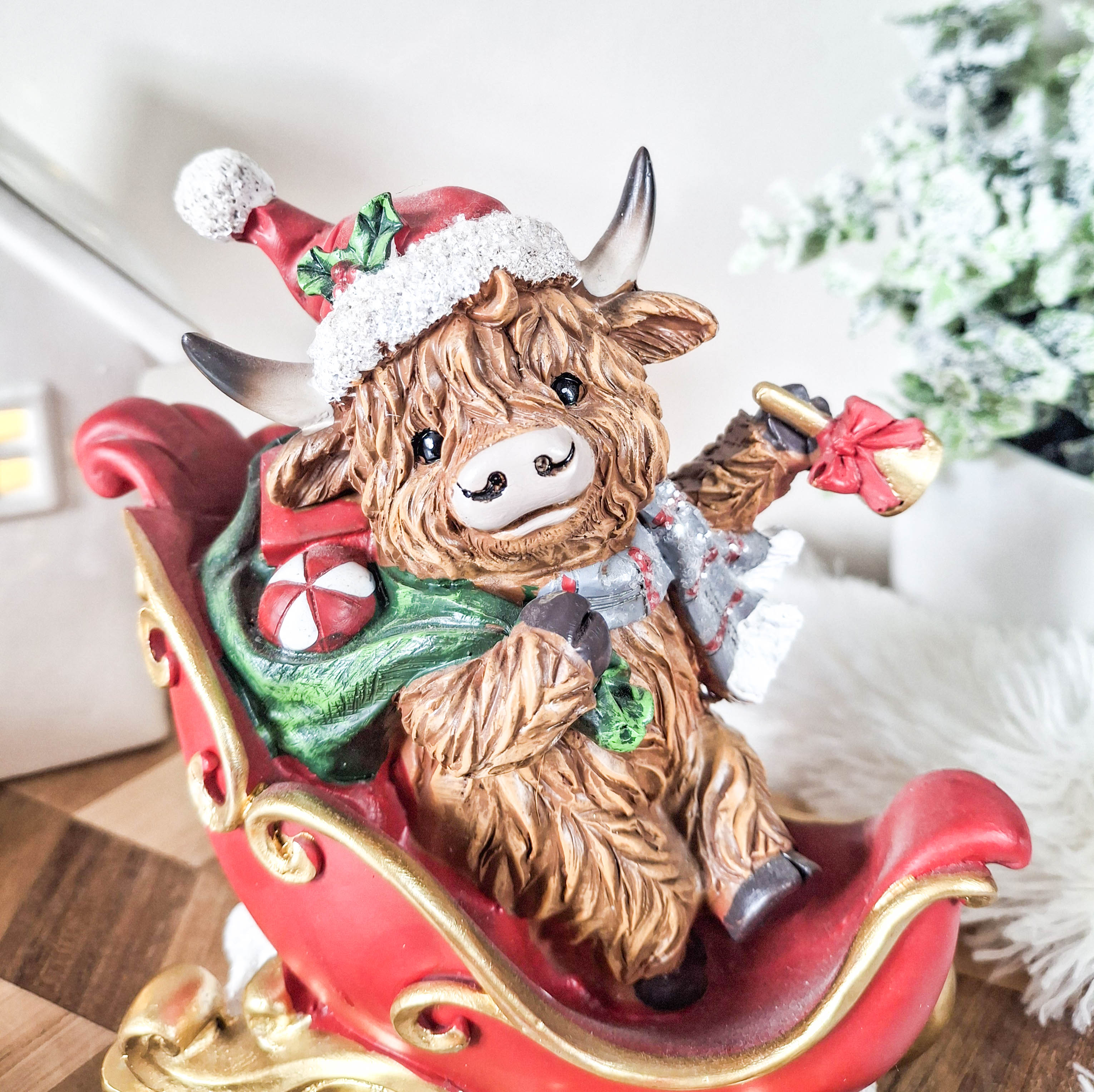 Christmas Highland Cow in Sleigh