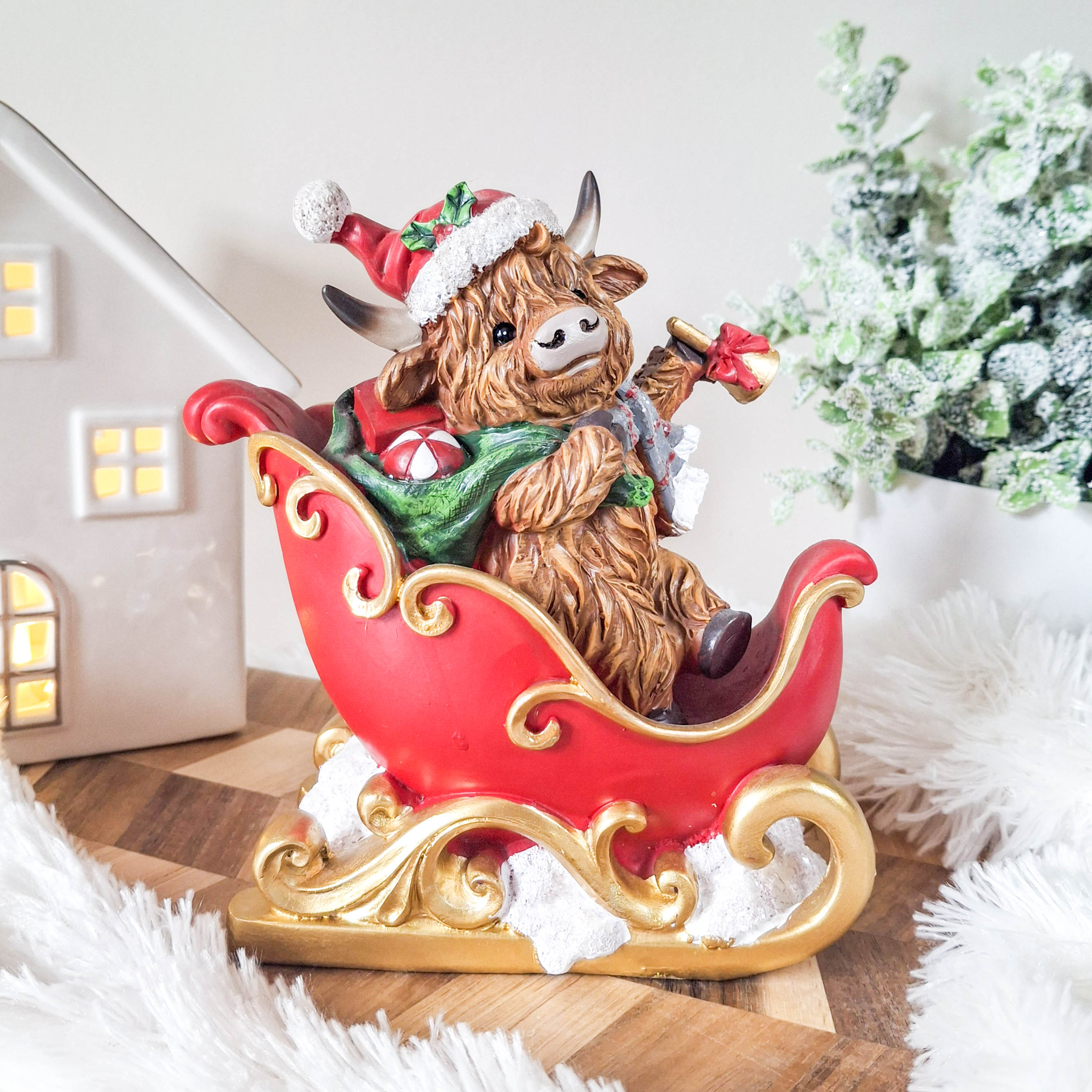 Christmas Highland Cow in Sleigh