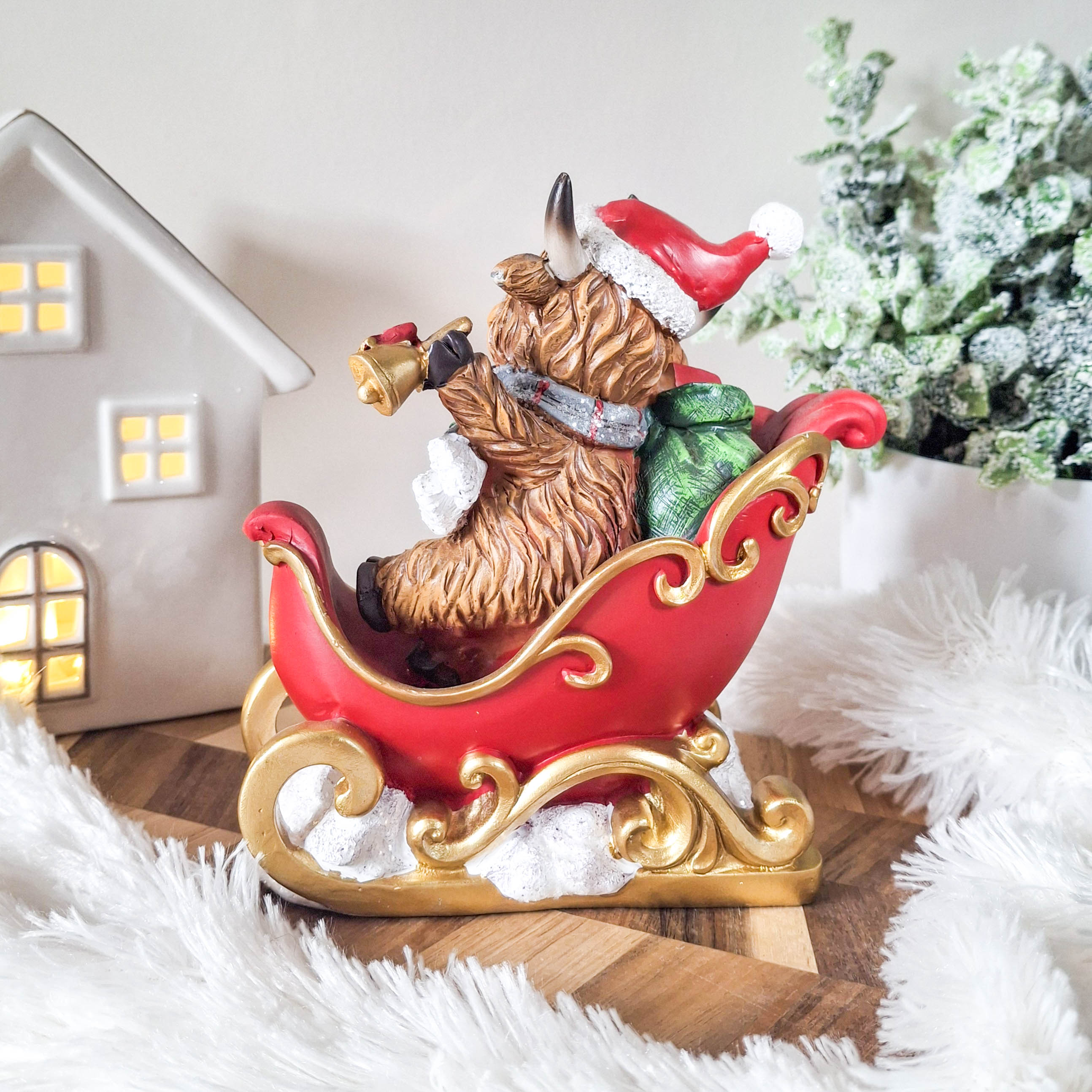 Christmas Highland Cow in Sleigh