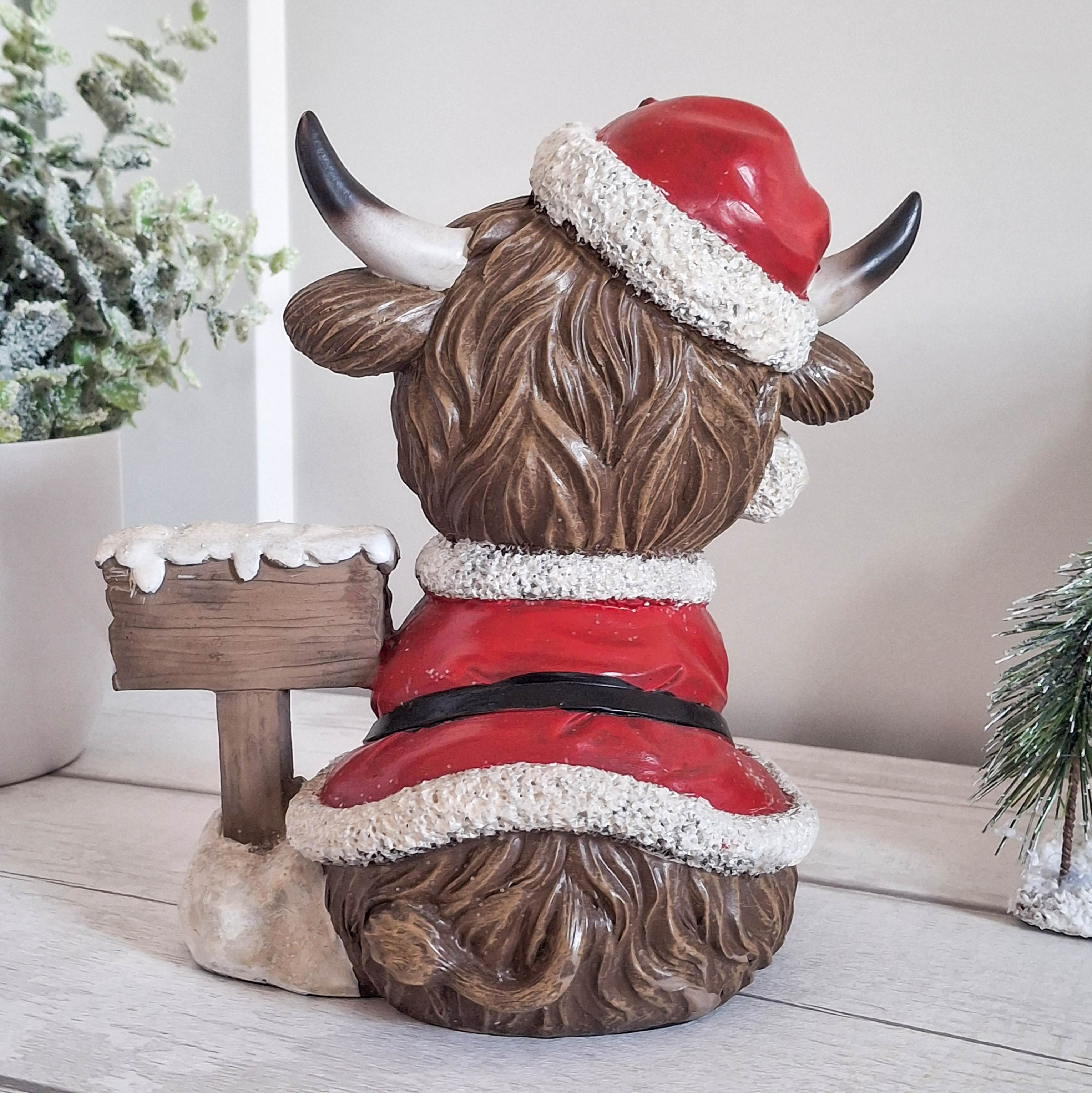 Highland Cow with Merry Christmas Sign