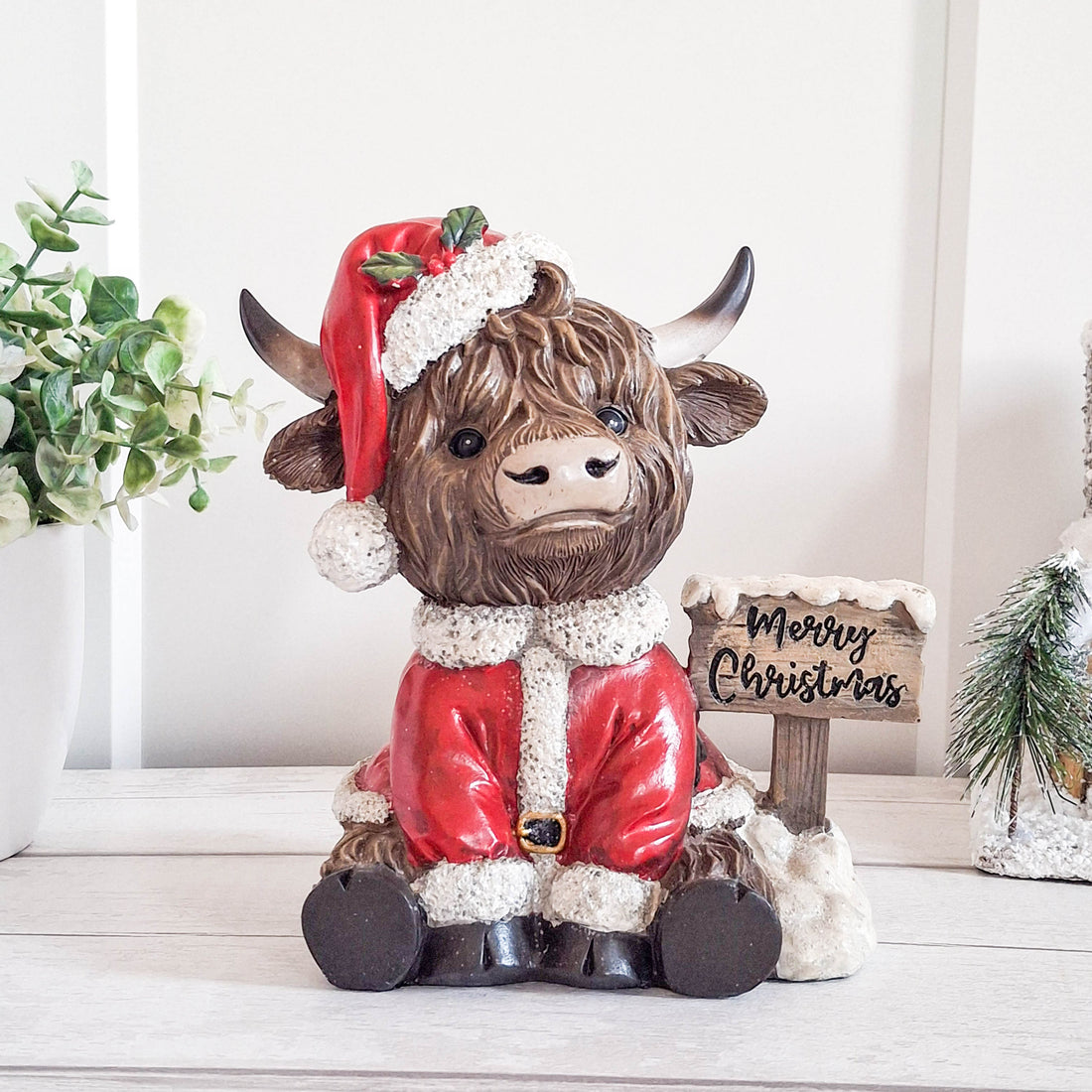 Highland Cow with Merry Christmas Sign