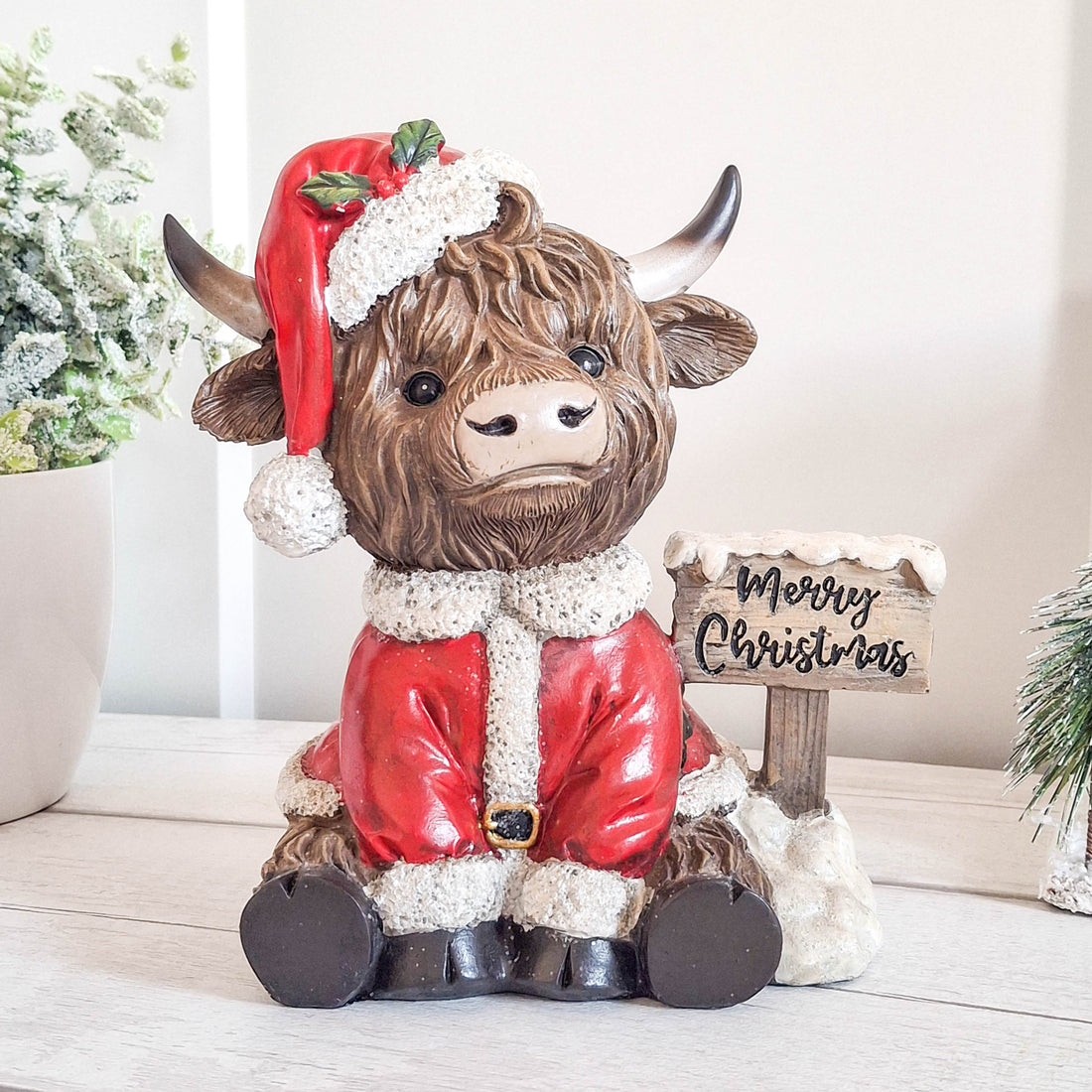 Highland Cow with Merry Christmas Sign