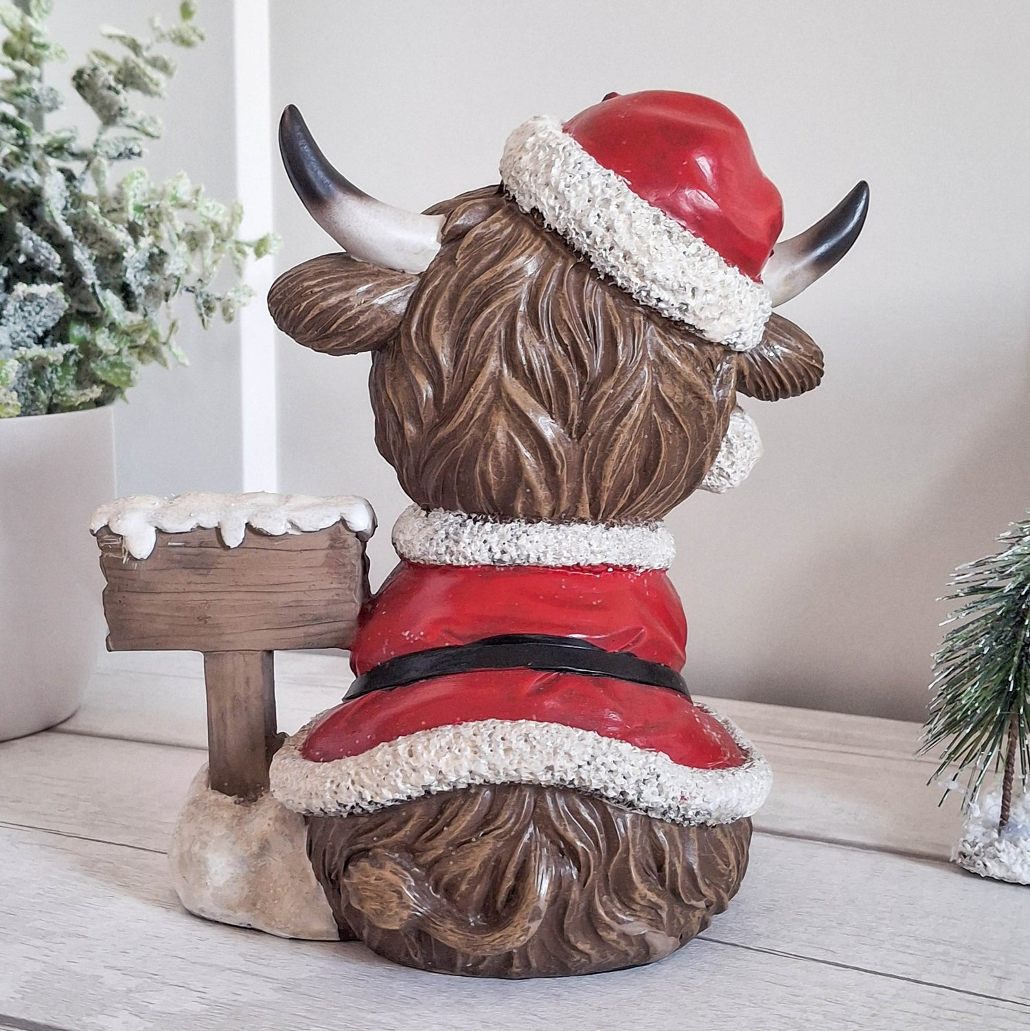 Highland Cow with Merry Christmas Sign