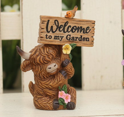 Small Highland Cow with Sign